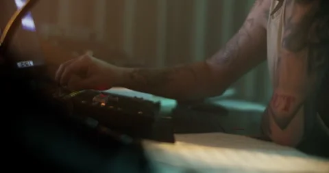 Man adjusting sound while composing music in recording studio Stock Footage 249911842