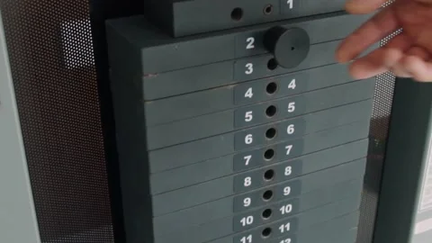 Man adjusting weights at the gym Video stock 132486115