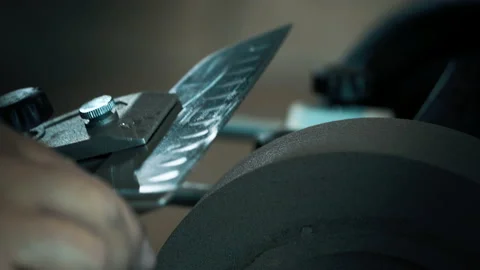 Man adjusts the angle on a grinder using an instrument Stock Footage 142156340