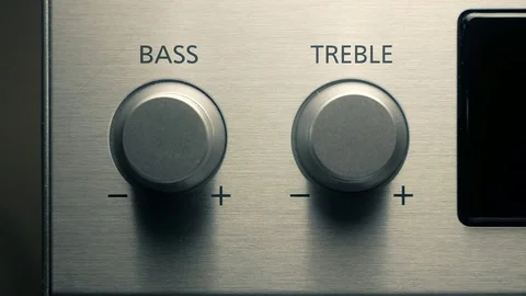 The man adjusts the bass Stock Footage 84479261