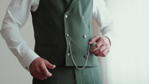 Man Adjusts Green Double Breasted Waistcoat With Pocket Watch Chain Stock Footage 347058865