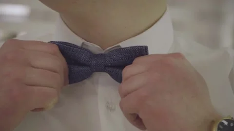 The man adjusts his blue bow tie Stock Footage 159881925
