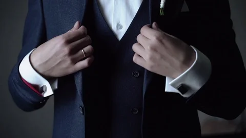A man adjusts his dressed jacket Stock-Footage 126385114