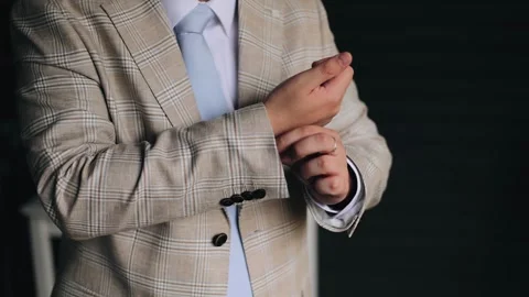 A man adjusts his jacket while getting dressed for a meeting Stock Footage 270757351