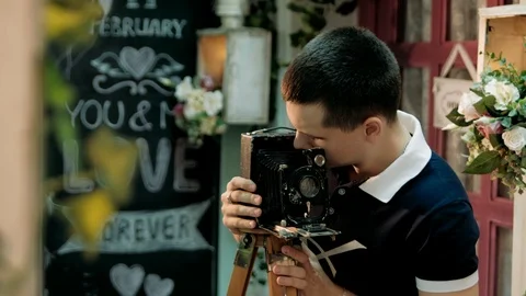 Man adjusts the an old retro camera close-up Stock Footage 89445630