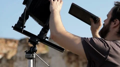 Man adjusts the retro camera close-up Stock Footage 71825884