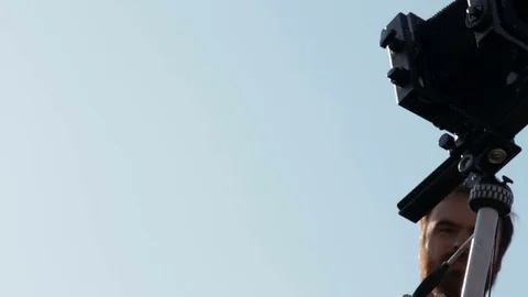 Man adjusts the retro camera close-up Stock Footage 71825891