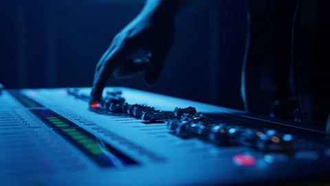 A man adjusts the sound using a controller during a performance Stock Footage 203809502