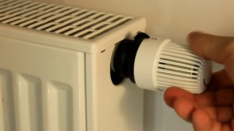 Man adjusts the temperature of the battery Stock Footage 86414292