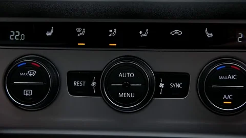 Man adjusts the temperature in the car Stock Footage 73940703