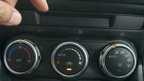 Man adjusts the temperature in the car. Stock Footage 79887541
