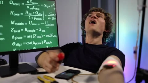 Man adjusts wearable biohacking device on arm after failed test at home Stock Footage 324444183