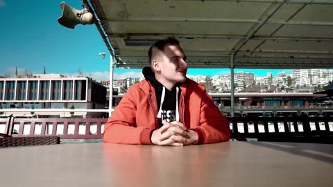 A man admires the city views from the deck of a boat in Istanbul, Türkiye Stock Footage 279942526