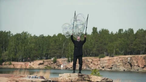 Man admits huge soap bubbles in nature Stock Footage 131491771