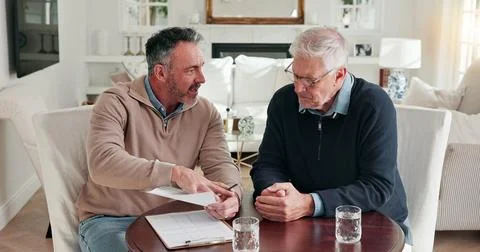 Man, advisor and talking at house with document, finance report or form for.. Stock Photos