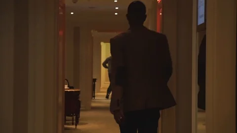 Man afro walking corridor in hotel 動画素材 98336450