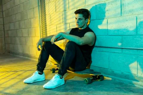 Man after skating in a cellar Stock Photos
