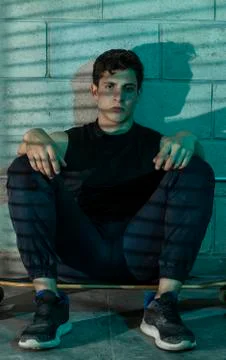 Man after skating in a cellar Stock Photos