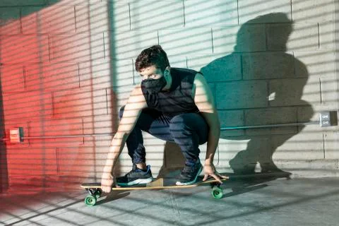 Man after skating in a cellar Stock Photos