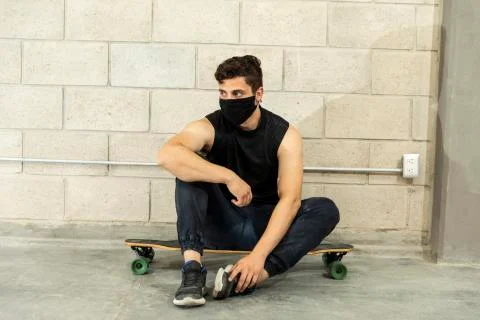 Man after skating in a cellar Stock Photos