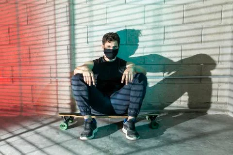 Man after skating in a cellar Stock Photos