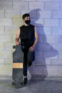 Man after skating in a cellar Stock Photos