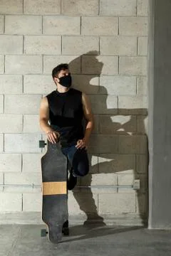 Man after skating in a cellar Stock Photos