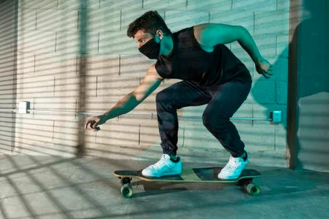 Man after skating in a cellar Stock Photos
