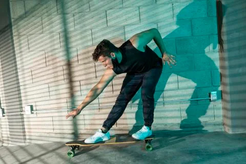 Man after skating in a cellar Stock Photos