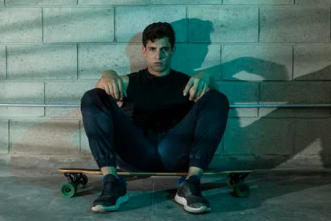 Man after skating in a cellar Stock Photos