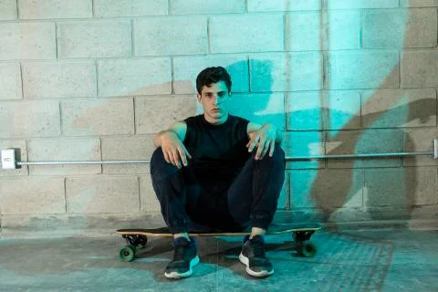 Man after skating in a cellar Stock Photos
