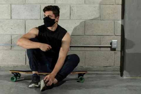 Man after skating in a cellar Stock Photos