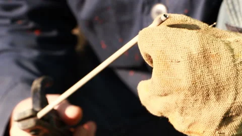 Man after welding cleans the electrode Stock Footage 85810559