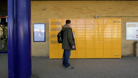 Man afterwork approaching Amazon Locker in Oxford united Kingdom Video stock 102736582