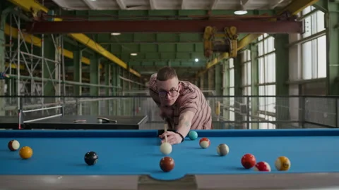 Man Aiming Cue Ball at Pool Table Front View Stock Footage 332769751
