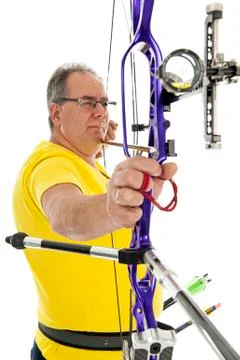 Man aiming with a longbow in closeup Stock Photos