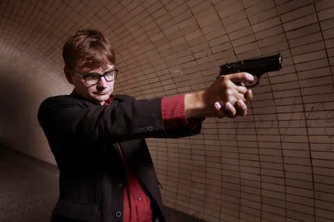 Man aiming on unknown target on public location in city Stock Photos