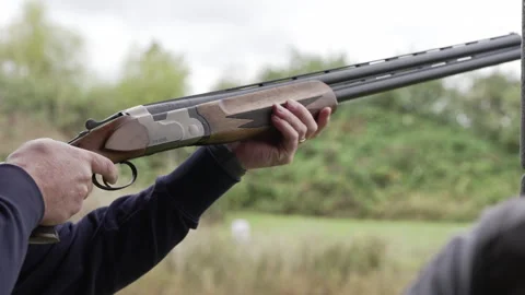Man aims following target and shoots shotgun firing range Stockbeeldmateriaal 346261151