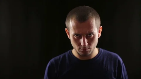 Man aims a gun at camera close up Stock Footage 70411206