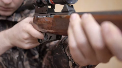 Man aims a rifle in target. Stock Footage 123706325