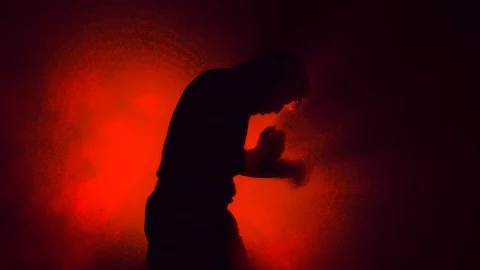 Man Air Boxing - Anger Concept -  Silhouette on Red Background Stock Footage 105603304