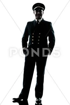 Man in airline pilot uniform silhouette Stock Photos