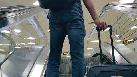 A man in airport metro escalator in new Stock Video Pond5