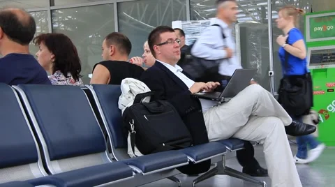 Man in airport with notebook Stock Footage 950923
