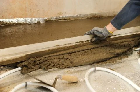 Man aligns  concrete Stock Photos