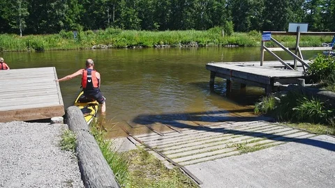 Man almost flips over in kayak Stock Footage 96373166