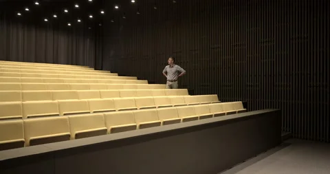 Man alone in the classroom during the epidemic pandemic Stock Footage 134178214