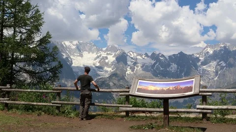 Man Alone looking greet panorama on  Aosta Valley mountains near Courmayeur Stock-Footage 96343543