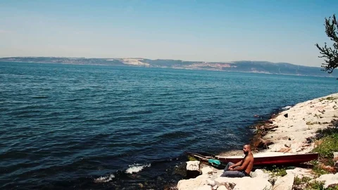 A man alone lost in his mind on the coast Video stock 93863567