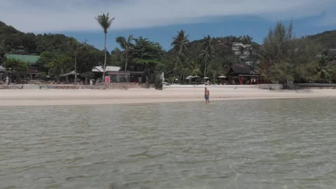 Man alone in the sea low angle shot Stock Footage 260431538